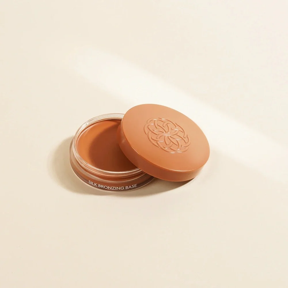 Nwt SILK BRONZING BASE. Sunset Glow.